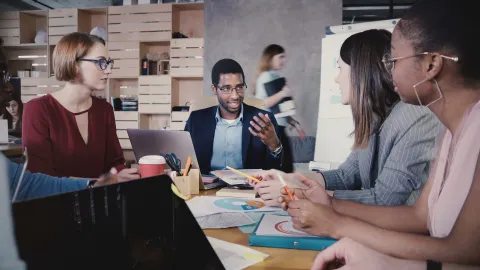 People working together round a table 