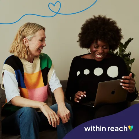 Two ladies working on a laptop with the logo 'within reach'