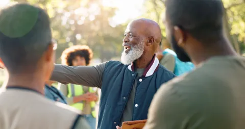 A man enjoying talking to others outside