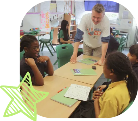 Volunteer from Climate Ed talking to a classroom