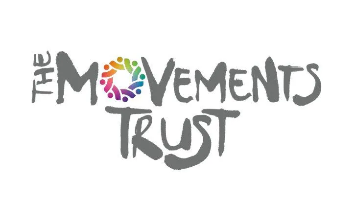 image shows the logo for The Movements Trust. All the letters are grey apart from the 'O' in 'movement' which is multicoloured.