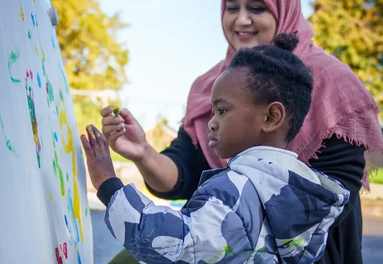 Child with SEND being supporting by a teacher