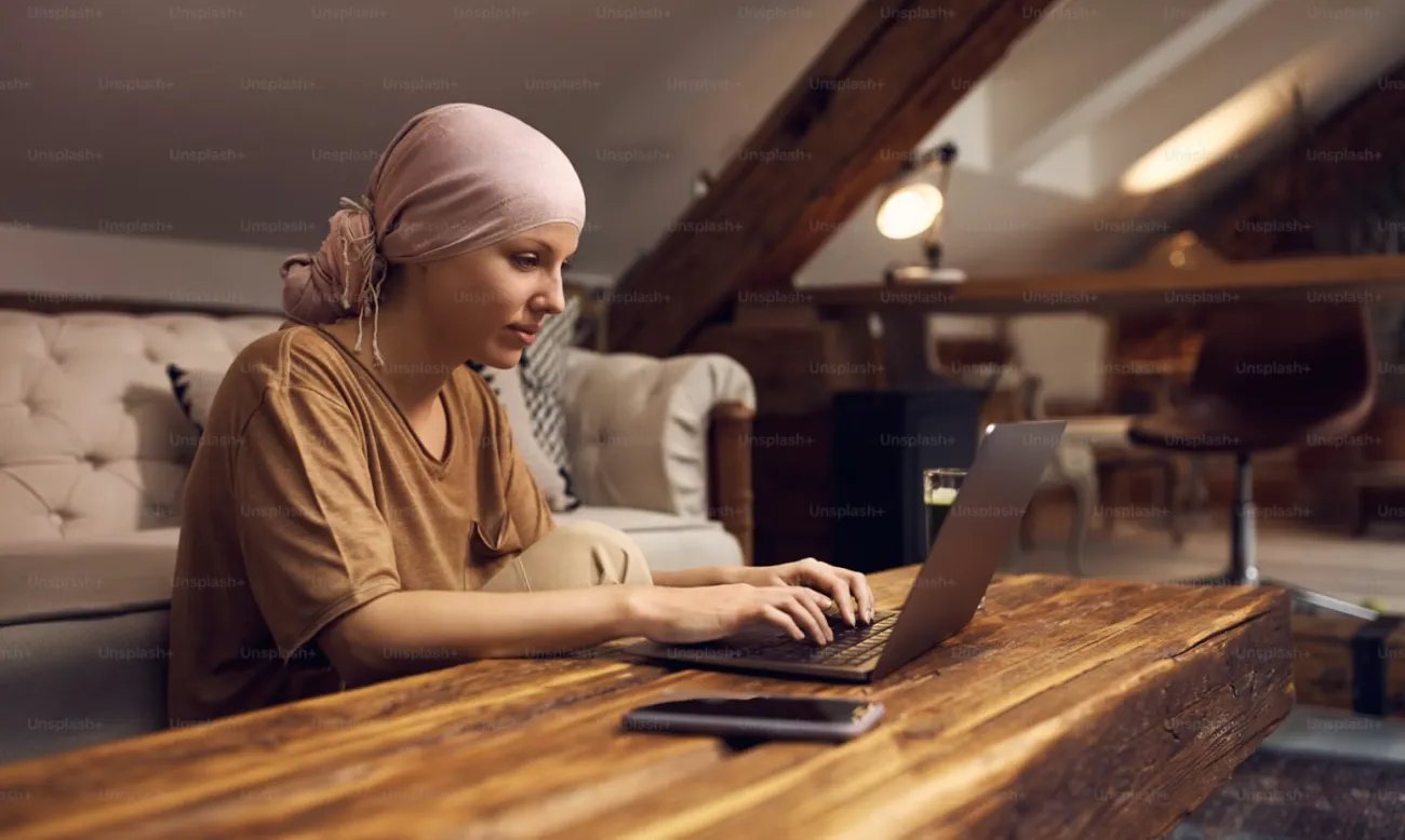 Young woman in headscarf using a computer