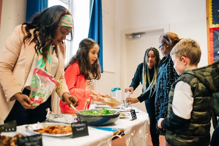 Members of the Heart of Newhaven Community enjoying a communal lunch