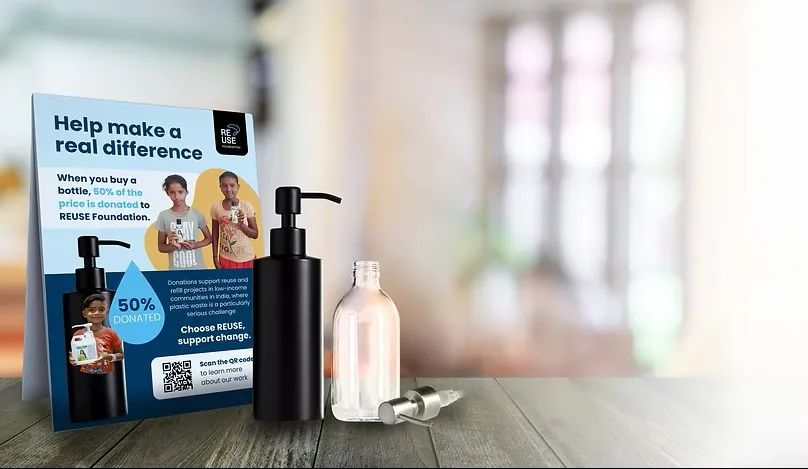 Refillable plastic bottles near a leaflet promoting the Reuse Foundation