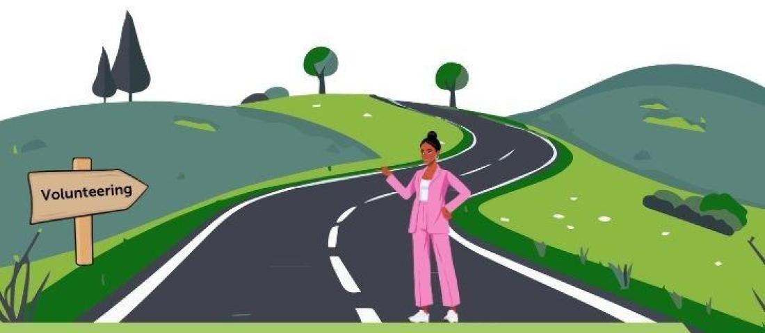 Image of a person standing on a road next to a signpost that reads 'Volunteering'
