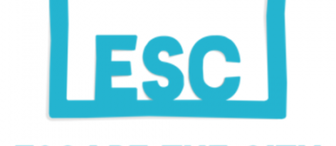 Image shows the logo for Escape the City which is a light blue rectangle with letters ESC written in it in light blue, with the words Escape the City centred under the rectangle, also in light blue.