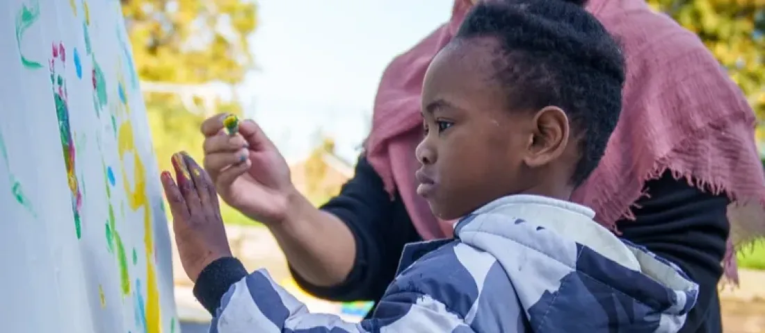 Child with SEND being supporting by a teacher
