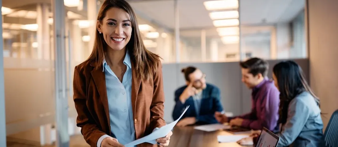 A woman with a CV looking to camera