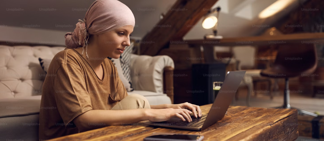 Young woman in headscarf using a computer