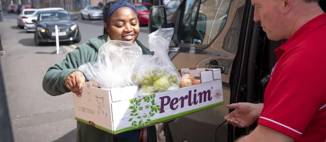 A Trussell volunteer delivering a food parcel